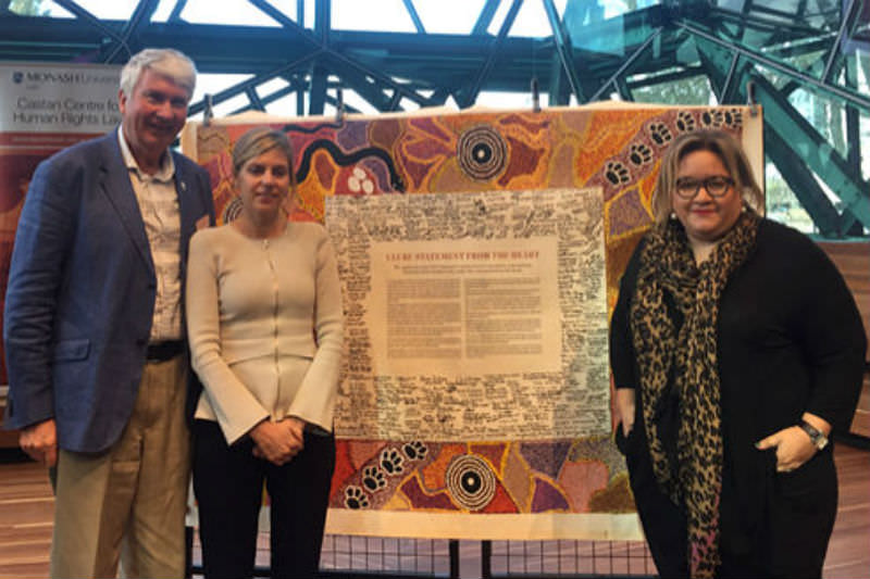 Frank Brennan, Kristen Hilton of VEOHRC and Professor Megan Davis of UNSW at the Castan Centre Human Rights Conference 2018 in front of the Uluru Statement from the Heart.