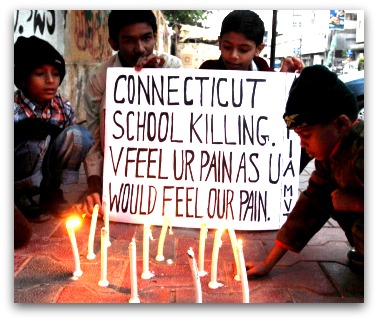 Pakistani children light candles to pay tribute to Sandy Hook Elementary School shooting victims in southern Pakistani port city of Karachi   Read more http://www.prafulla.net/graphics/photography/in-photos-the-world-grieving-for-sandy-hook/